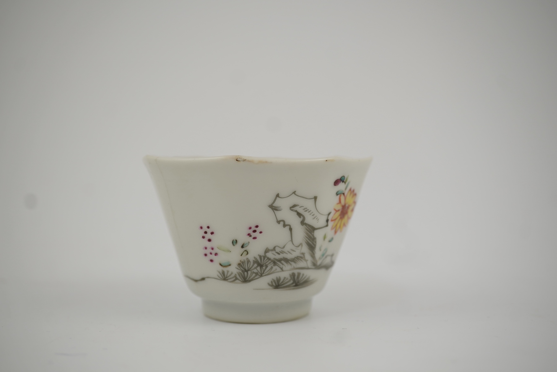 Two Chinese semi-eggshell porcelain hexagonal saucers and a similar cup, Yongzheng/Qianlong period